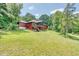 Red house with deck and screened porch at 3240 Hillcastle Trl, Chapel Hill, NC 27516