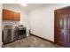 Laundry room with stainless steel appliances and cabinets at 3240 Hillcastle Trl, Chapel Hill, NC 27516