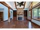 Spacious living room with hardwood floors, fireplace, and built-in shelving at 3240 Hillcastle Trl, Chapel Hill, NC 27516