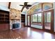 Living room with stone fireplace and access to deck at 3240 Hillcastle Trl, Chapel Hill, NC 27516