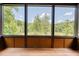 Enjoy tranquil wooded views from this screened porch at 3240 Hillcastle Trl, Chapel Hill, NC 27516