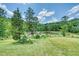 Landscaped yard with pond views at 3240 Hillcastle Trl, Chapel Hill, NC 27516