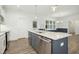 Modern kitchen island with granite countertops and stainless steel appliances at 33 Winterwood Dr, Benson, NC 27504