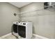 Laundry room with washer, dryer, and ample shelving at 3341 Sandy Meadow Dr Dr, Fuquay Varina, NC 27526