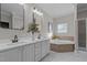 Double vanity bathroom with soaking tub and shower at 3450 Leaflet Church Rd, Broadway, NC 27505