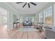 Living room with light walls, hardwood floors, and comfortable seating at 3450 Leaflet Church Rd, Broadway, NC 27505