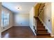 Spacious living room featuring hardwood floors and a staircase at 360 Sandy Ridge Rd, Dunn, NC 28334