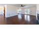 Spacious living room with hardwood floors, fireplace, and access to deck at 360 Sandy Ridge Rd, Dunn, NC 28334