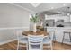 Bright dining area with wooden table and chairs, and a chandelier at 391 Northview Dr, Sanford, NC 27332