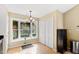 Breakfast nook with built-in shelving and bay window overlooking yard at 402 Berryhill Dr, Carrboro, NC 27510