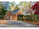 Brick home with a landscaped yard and driveway at 402 Berryhill Dr, Carrboro, NC 27510