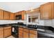 Well-equipped kitchen with gas stove and ample cabinet space at 402 Berryhill Dr, Carrboro, NC 27510