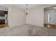 Bright dining room with chandelier and hardwood flooring at 4148 White Kestrel Dr, Raleigh, NC 27616