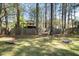 Large backyard with a hammock and cornhole games at 429 Walnut St, Cary, NC 27511