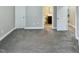 Large bedroom with grey carpet and access to bathroom at 5509 Sapphire Springs Dr, Knightdale, NC 27545