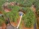 Aerial view of house and driveway, surrounded by trees at 5600 Thornburg Dr, Wake Forest, NC 27587