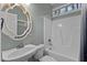 Bathroom with a bathtub, shower, and an ornate mirror at 5600 Thornburg Dr, Wake Forest, NC 27587