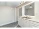 White kitchen cabinets and gray flooring with a view into the dining area at 7100 Lake Myra Rd, Wendell, NC 27591