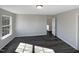 Spacious bedroom with a window and dark gray vinyl plank flooring at 720 Forrest Ln, Creedmoor, NC 27522