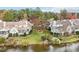 Aerial perspective showcasing waterfront homes in a golf course community at 739 Crabtree Crossing Pkwy, Cary, NC 27513