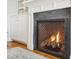 Elegant fireplace with herringbone brick and gray surround at 739 Crabtree Crossing Pkwy, Cary, NC 27513