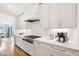 Modern kitchen with stainless steel appliances and white cabinets at 739 Crabtree Crossing Pkwy, Cary, NC 27513