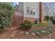 Side view of house showing a deck and brick accents at 8012 Llewellyn Ct, Raleigh, NC 27613