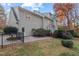 Exterior of house showcasing a deck and manicured lawn at 8012 Llewellyn Ct, Raleigh, NC 27613