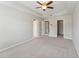 Spacious bedroom with ceiling fan and carpeted floors at 8329 Niayah Way, Raleigh, NC 27612