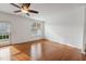 Bright living room with hardwood floors and door leading to patio at 8329 Niayah Way, Raleigh, NC 27612