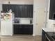 This kitchen features dark cabinets, white countertops, and stainless steel appliances at 1008 Willow Ridge Dr, Knightdale, NC 27545