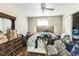 Bedroom with floral bedspread and dresser at 114 Barnhill St, Durham, NC 27707