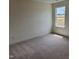 Simple bedroom with neutral carpet and a large window at 115 Stallion Way, Benson, NC 27504