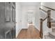 Bright entryway with hardwood floors, a staircase, and neutral walls at 115 Stallion Way, Benson, NC 27504