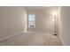 Well-lit bedroom with carpet and floor lamp at 135 Station Dr, Morrisville, NC 27560