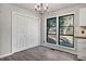 Dining area with hardwood floors, a chandelier, and large windows at 144 Loblolly Ln, Chapel Hill, NC 27516