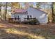 House exterior showcasing a deck and wooded setting at 144 Loblolly Ln, Chapel Hill, NC 27516