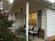 Cozy front porch with seating area and flowering plants at 1454 Cimarron Pkwy # 17, Wake Forest, NC 27587