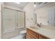 Clean bathroom with a sliding glass shower door and wood vanity at 148 Silver Lake Pt Pt, Sanford, NC 27332