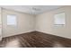 Simple bedroom with dark brown laminate wood flooring and ceiling fan at 148 Silver Lake Pt Pt, Sanford, NC 27332