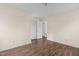 Bright bedroom with wood flooring and access to a hallway with additional rooms at 148 Silver Lake Pt Pt, Sanford, NC 27332