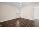 Bedroom with dark brown laminate wood flooring and a ceiling fan at 148 Silver Lake Pt Pt, Sanford, NC 27332