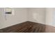 Simple bedroom with hardwood floors and a window at 148 Silver Lake Pt Pt, Sanford, NC 27332