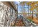 Exterior of home showcasing a walkway with autumn leaves and lake views at 148 Silver Lake Pt Pt, Sanford, NC 27332