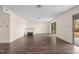 Gathering room with dark brown laminate wood flooring and sliding glass doors to patio at 148 Silver Lake Pt Pt, Sanford, NC 27332
