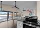 Kitchen with stainless steel appliances and granite countertops, overlooking a deck and water view at 148 Silver Lake Pt Pt, Sanford, NC 27332