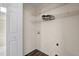 Small laundry room with wire shelving and space for a washer and dryer at 148 Silver Lake Pt Pt, Sanford, NC 27332