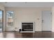Living room featuring a fireplace, hardwood floors, and deck access at 148 Silver Lake Pt Pt, Sanford, NC 27332