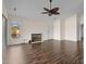 Living room featuring hardwood floors, a fireplace, and access to a deck at 148 Silver Lake Pt Pt, Sanford, NC 27332