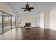 Living room with fireplace, hardwood floors, and sliding doors to deck at 148 Silver Lake Pt Pt, Sanford, NC 27332